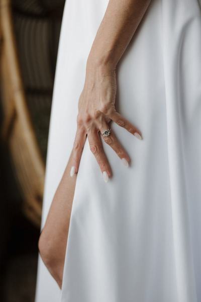 Close-up of bride adjusting bracelet or jewelry at The Ben Autograph Collection Hotel Palm Beach