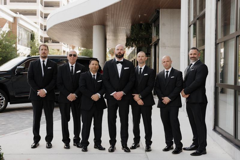 Groom and groomsmen standing in V-shape formation at The Ben Autograph Collection Hotel Palm Beach