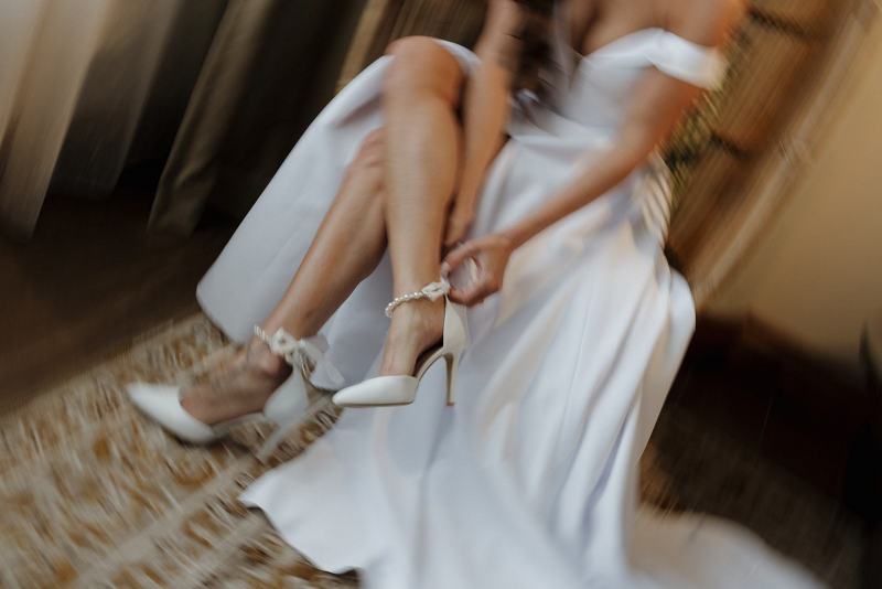 Detail of bride’s manicure and rings while holding bouquet at The Ben Autograph Collection Hotel Palm Beach