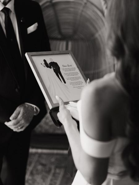 Close-up of bride reading vows with groom listening at The Ben Autograph Collection Hotel Palm Beach