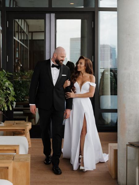 Candid of bride and groom laughing together during portrait session at The Ben Autograph Collection Hotel Palm Beach