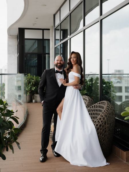 Candid of bride and groom laughing together during portrait session at The Ben Autograph Collection Hotel Palm Beach
