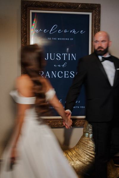 Intimate moment of bride and groom holding hands near reception area at The Ben Autograph Collection Hotel Palm Beach