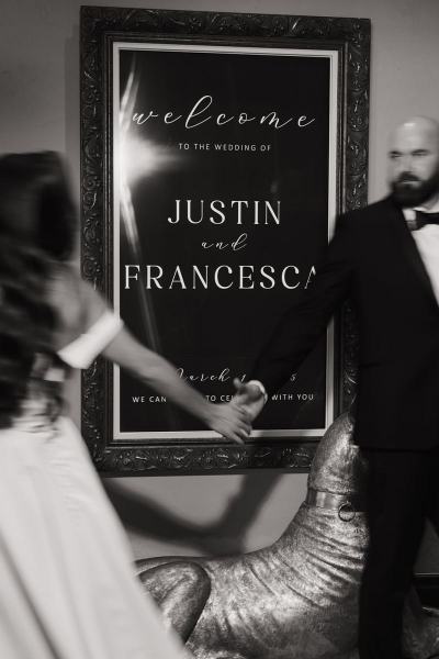 Intimate moment of bride and groom holding hands near reception area at The Ben Autograph Collection Hotel Palm Beach