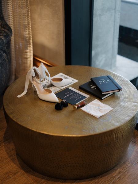 Wedding invitation suite flat lay on table at The Ben Autograph Collection Hotel Palm Beach