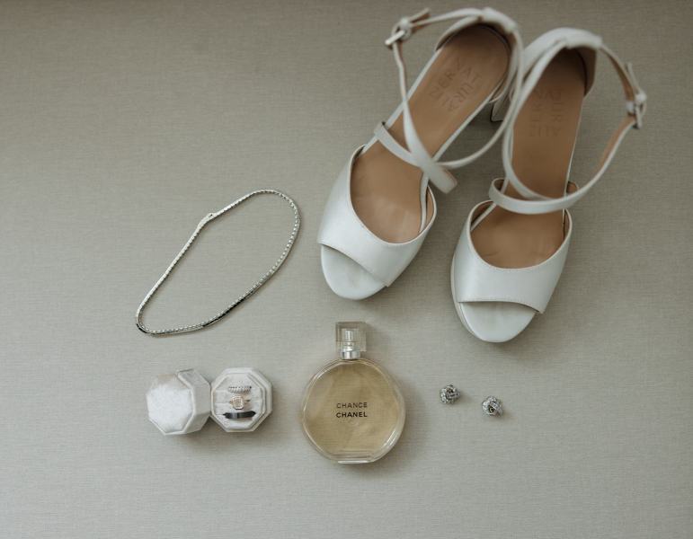 Flat lay of bridal shoes, jewelry, and accessories at Spanish Monastery Miami