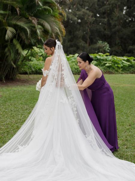 Bride laughing while holding bouquet at Spanish Monastery Miami