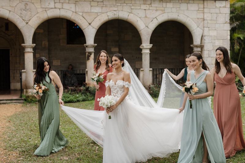 Bridesmaids posing with bride at Spanish Monastery Miami