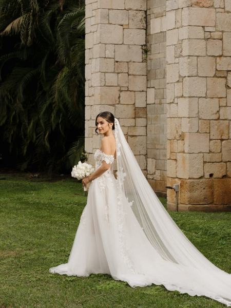Bride standing alone in gown at Spanish Monastery Miami