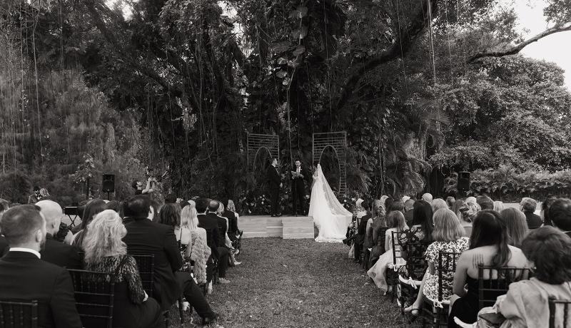 Wide-angle shot of ceremony aisle with bride walking at Spanish Monastery Miami