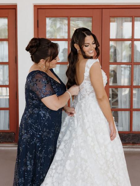 Bride adjusting dress before ceremony at Islamorada Fish Company Florida Keys
