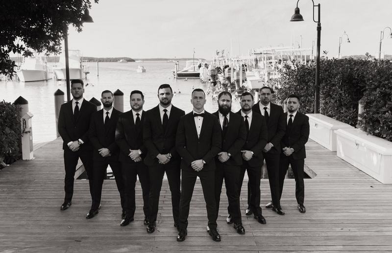 Wide shot of groomsmen with groom at Islamorada Fish Company Florida Keys