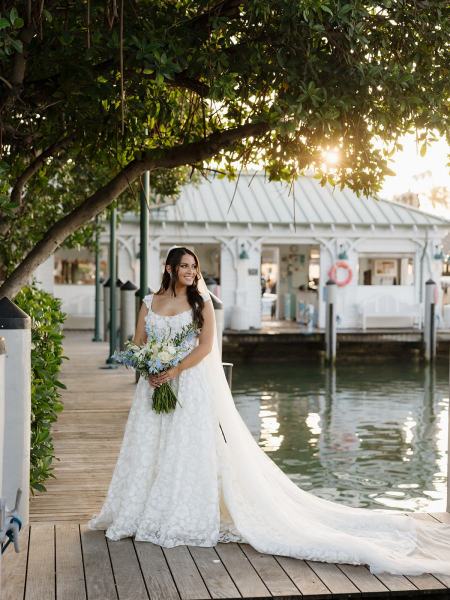 Bride holding bouquet while posing at Islamorada Fish Company Florida Keys