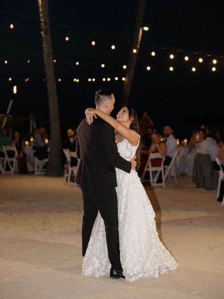 Couple dancing with guests watching at Islamorada Fish Company Florida Keys