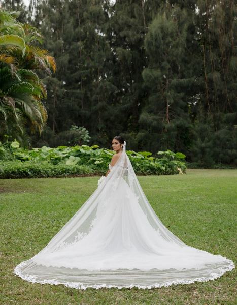 Bride standing alone in gown at Spanish Monastery Miami