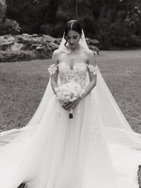 Bride standing alone in gown at Spanish Monastery Miami
