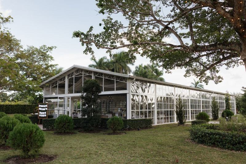 Wide shot of Cinco Farms Miami ceremony setup with chairs and aisle