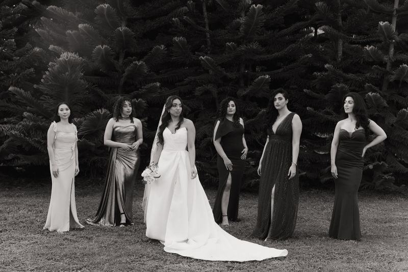 Bride and bridesmaids walking down path at Cinco Farms Miami