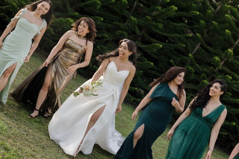 Bride and bridesmaids walking down path at Cinco Farms Miami