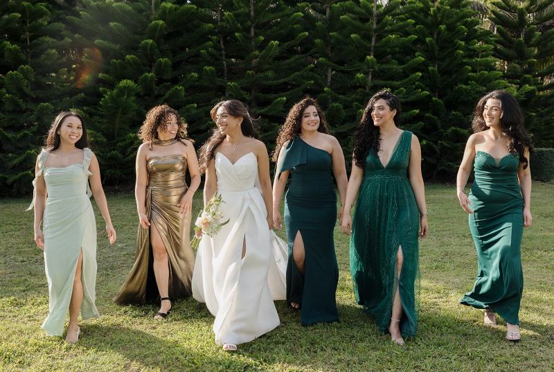 Bride and bridesmaids walking down path at Cinco Farms Miami