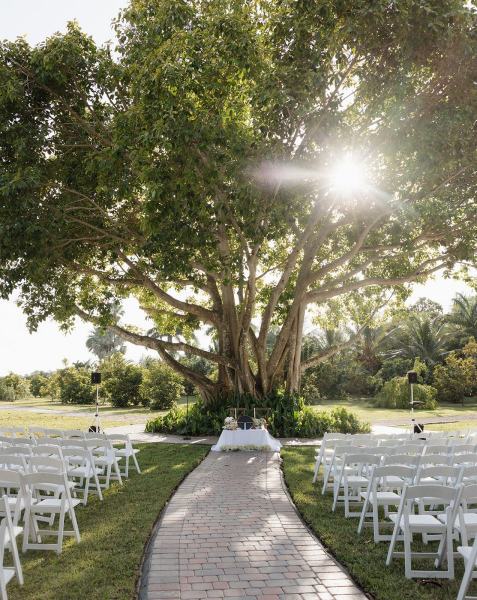 White chairs lined up for ceremony at Cinco Farms Miami