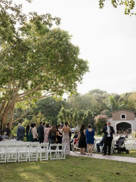 White chairs lined up for ceremony at Cinco Farms Miami