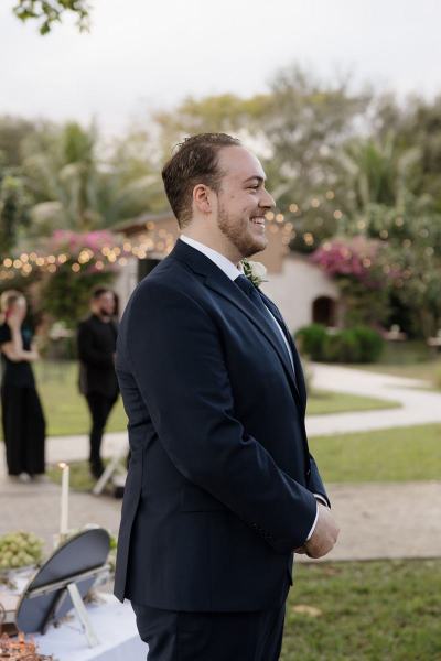 Groom watching bride arrive at Cinco Farms Miami ceremony