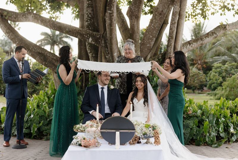 Couple holding hands at Cinco Farms Miami wedding