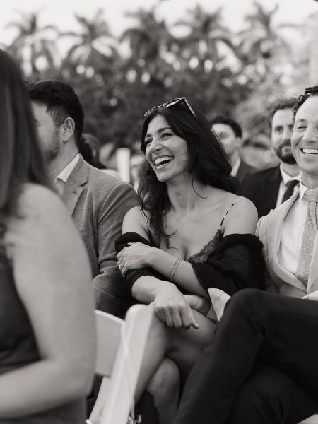 Guests applauding after bride and groom kiss at Cinco Farms Miami