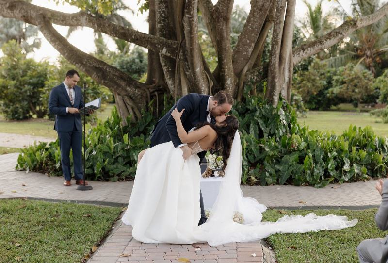 Couple’s first kiss at Cinco Farms Miami ceremony