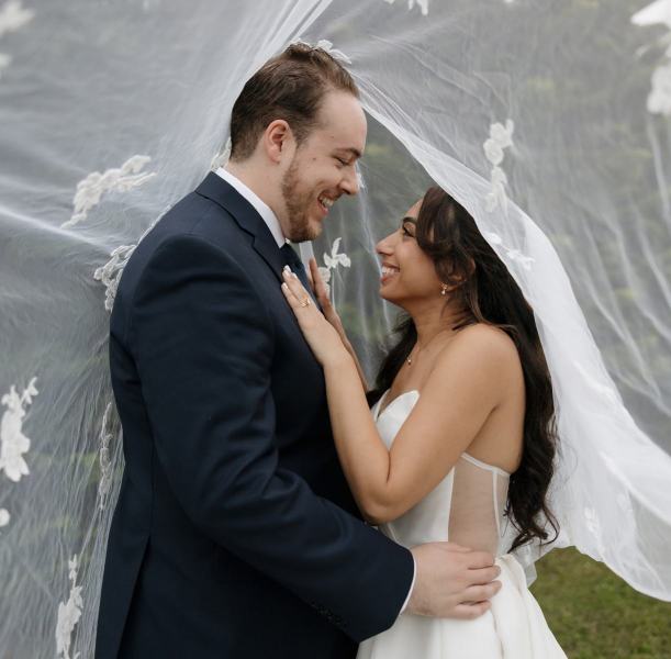 Bride and groom looking into each other’s eyes at Cinco Farms Miami