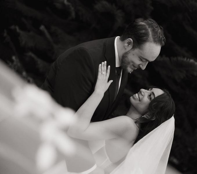 Bride and groom sharing a kiss under the veil at Cinco Farms Miami