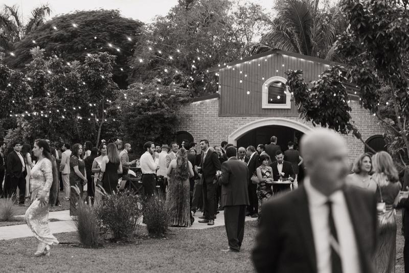 Outdoor reception setup with lanterns and lights at Cinco Farms Miami