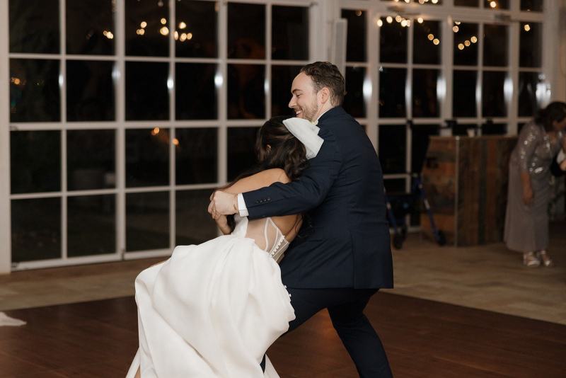 Romantic first dance under string lights at Cinco Farms Miami