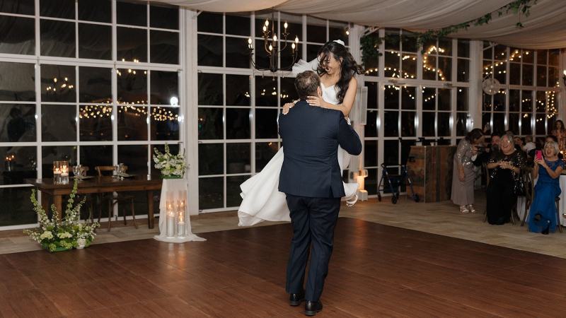 Romantic first dance under string lights at Cinco Farms Miami