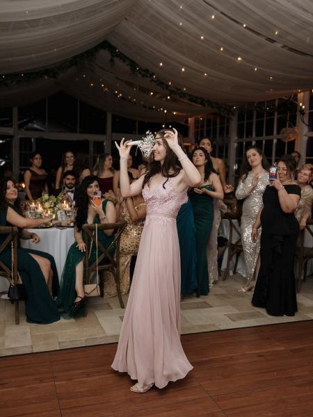 Guests taking photos of wedding cake at Cinco Farms Miami reception