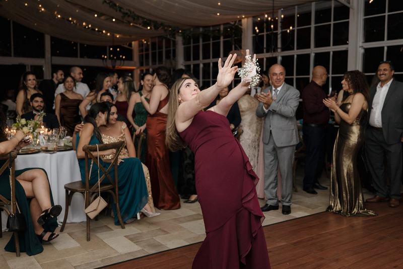 Guests taking photos of wedding cake at Cinco Farms Miami reception