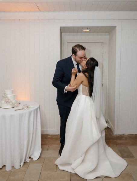 Bride and groom sharing a kiss at Cinco Farms Miami wedding