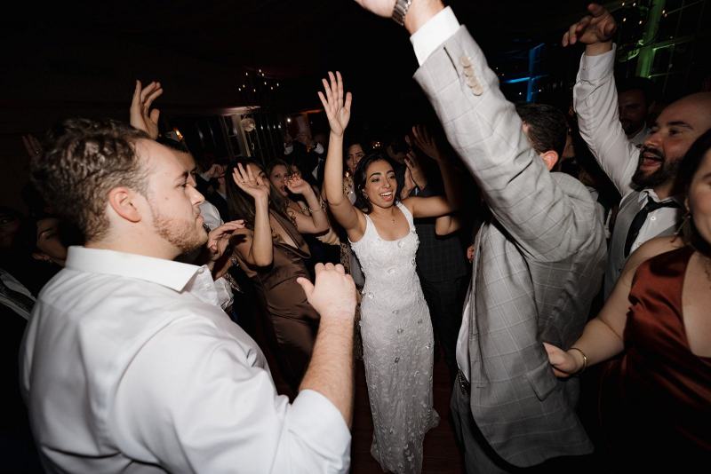 Bride and groom dancing with guests at Cinco Farms Miami reception