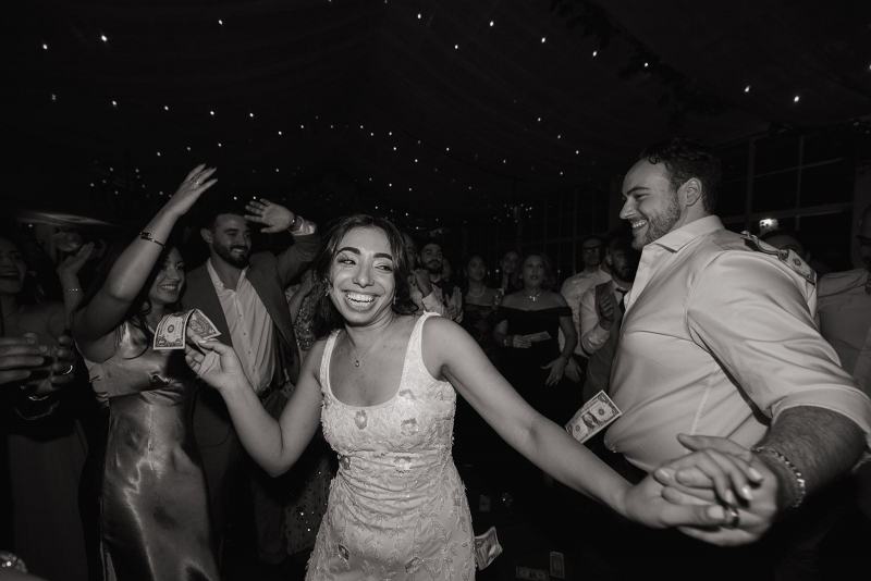 Wedding party dancing together at Cinco Farms Miami