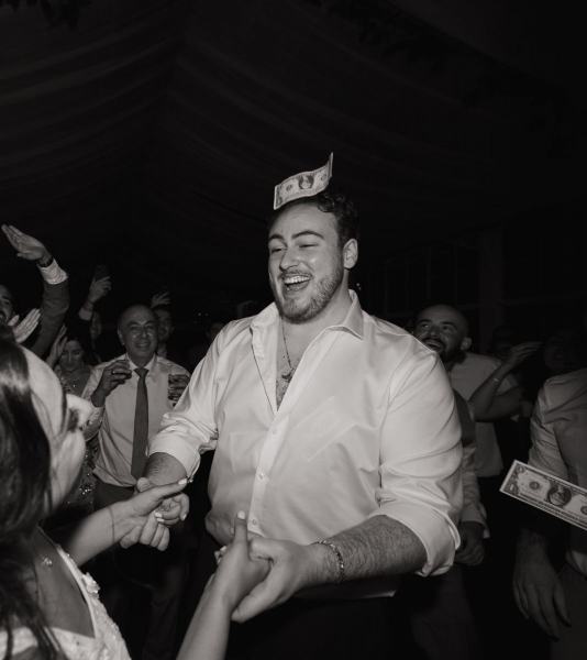 Wedding party dancing together at Cinco Farms Miami