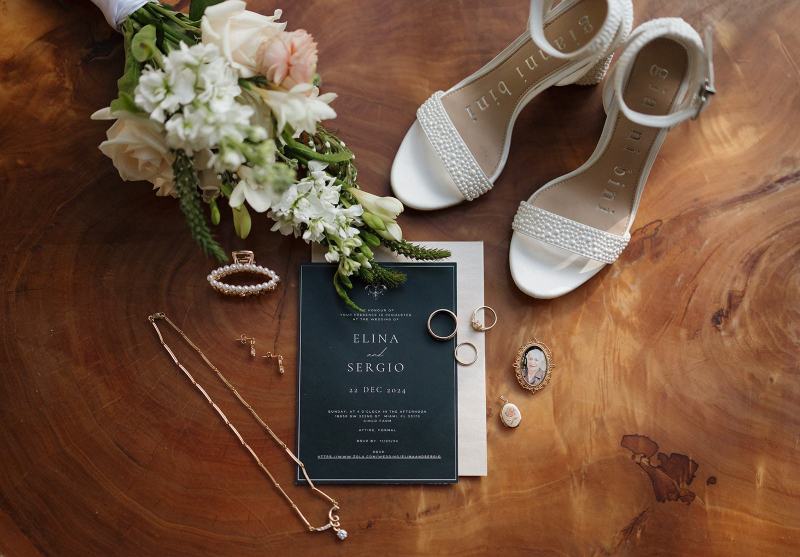 Flat lay of groom’s cufflinks and boutonniere at Cinco Farms Miami