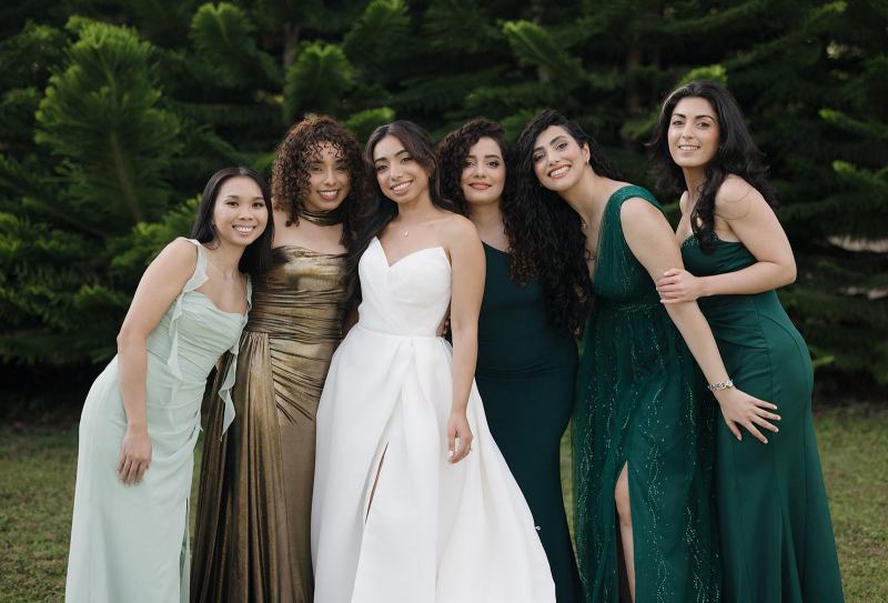Bride and bridesmaids walking down path at Cinco Farms Miami