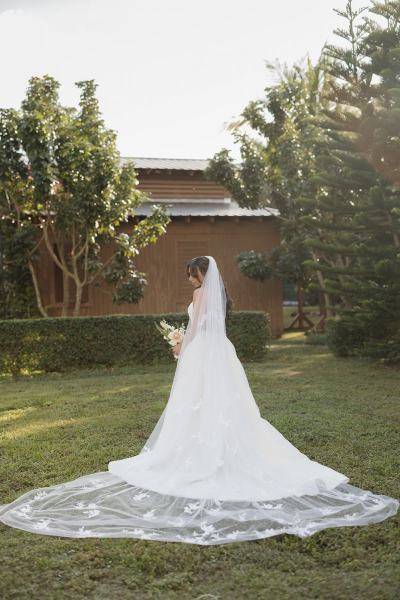 Bride standing with bouquet at Cinco Farms Miami wedding