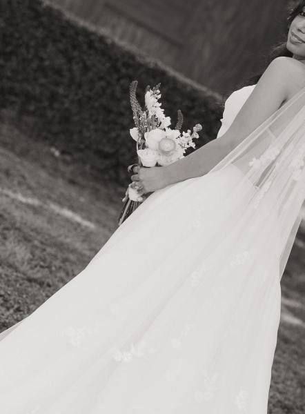 Bride standing with bouquet at Cinco Farms Miami wedding