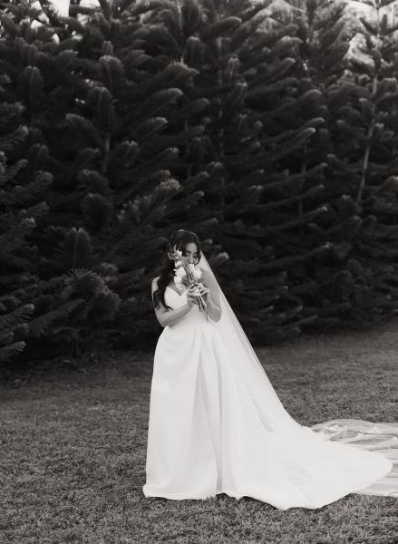 Bride standing with bouquet at Cinco Farms Miami wedding