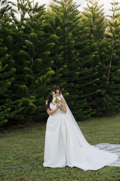 Bride standing with bouquet at Cinco Farms Miami wedding
