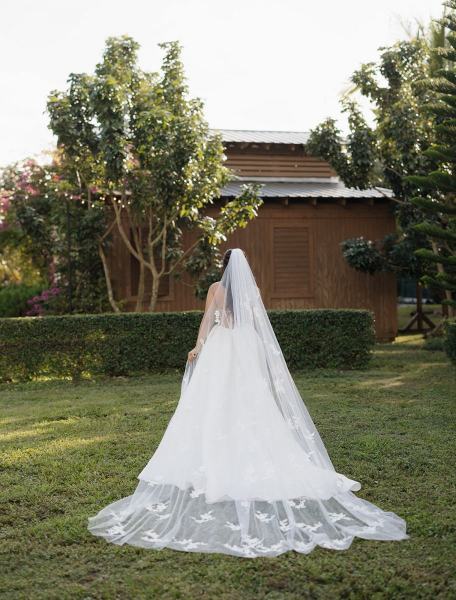 Bride posing in garden for solo portrait at Cinco Farms Miami