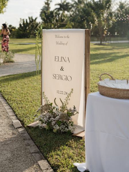 White chairs lined up for ceremony at Cinco Farms Miami