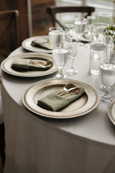 Reception tables with floral centerpieces at Cinco Farms Miami